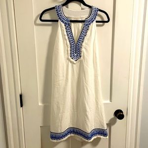 White sundress with neckline and hem embroidered detail